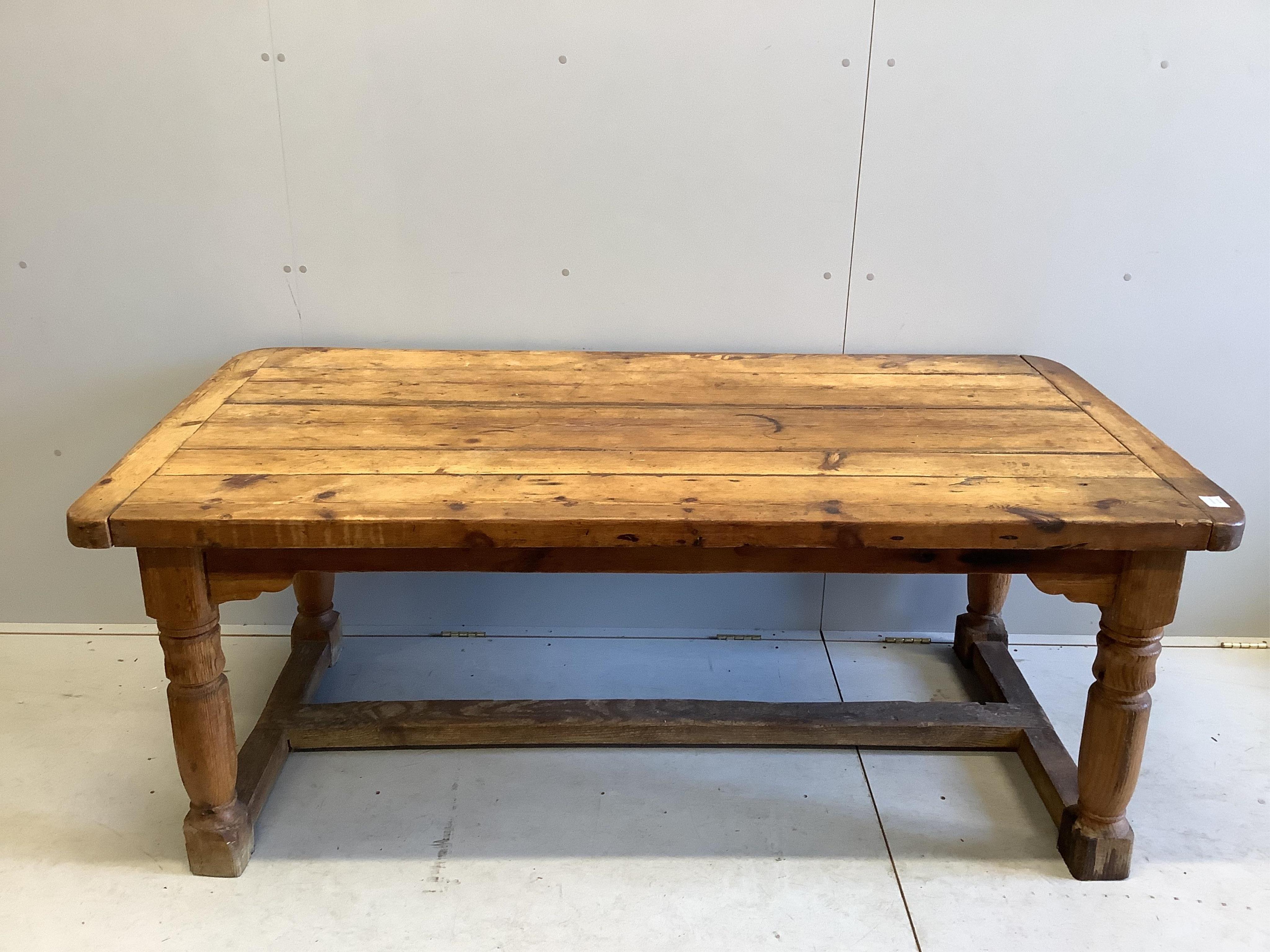 An 18th century style rectangular pine refectory table, width 180cm, depth 90cm, height 72cm. Condition - fair